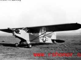 A tidy looking L-5 airplane parked in a field in the CBI during WWII.  Photo from Kenneth M. Sumney.