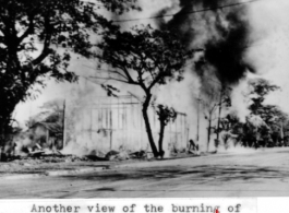 View of a building burning in Rangoon, Burma. In the CBI during WWII.