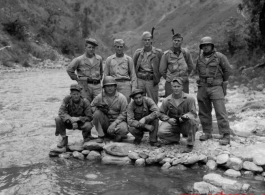 A group of American GIs during WWII near a river, likely in SW China, or Burma.