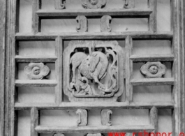 A carved wooden door panel in China. During WWII.  From the collection of Frank Bates.