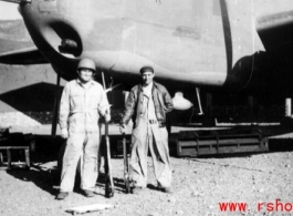 John Carberry and Claude Darni in front of B-25 and holding rifles in Yangkai, Spring 1944.