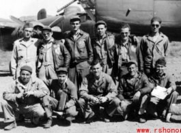 Ringer Squadron personnel: Lecher, Schmidt, Clark, Penny, Routon; rear; Bryan, Gornick, Gebhart, Williams, Vollmer, Arndt at Yangkai, Early 1945, with a B-25 in the background.  From the collection of Frank Bates.