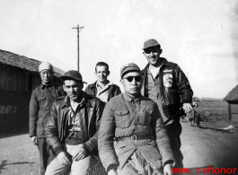 Three US servicemen with a local civilian and with a Chinese soldier, most likely in Yangkai, Yunnan, China.  Walter is sitting on the left in the front.