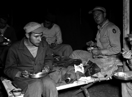 Here the men eat in their tent while on campout at Qingshuihai lake 清水海.