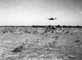 An American B-25 bomber flies at minimum altitude, probably during training / practice of 'low-level attack techniques', for 'skip bombing'.   B-25 pilots of the Tenth Air Force (341st Bomb Group) and Chinese-American Composite Wing (1st Bomb Group) were trained in 'skip bombing' in India during 1943 and 1944.