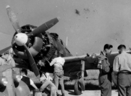 rew working out in the open on a non-American aircraft somewhere in southern China.  This is likely a Japanese Nakajima Ki-84 Hayate which the Chinese air force received after the war. 