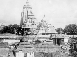 Enormous temple complex and architecture in India, at the large Jagannath Temple of Odisha complex (Hindu) in India.  Scenes in India witnessed by American GIs during WWII. For many Americans of that era, with their limited experience traveling, the everyday sights and sounds overseas were new, intriguing, and photo worthy.