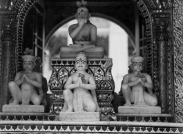 Small ornate altar.  Scenes in India witnessed by American GIs during WWII. For many Americans of that era, with their limited experience traveling, the everyday sights and sounds overseas were new, intriguing, and photo worthy.