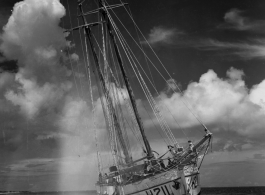 Boat 'Icaros", #H211, aground on the sandy shore in India.  Scenes in India witnessed by American GIs during WWII. For many Americans of that era, with their limited experience traveling, the everyday sights and sounds overseas were new, intriguing, and photo worthy.