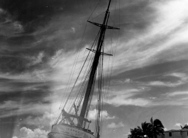 Boat 'Icaros" ground on the sandy shore in India.  Scenes in India witnessed by American GIs during WWII. For many Americans of that era, with their limited experience traveling, the everyday sights and sounds overseas were new, intriguing, and photo worthy.