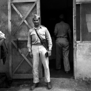 David Firman was a member of the 61st Air Service Group. Here he is standing at Hsinching, China.  10th Army Air Force.