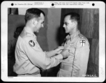 Lt. Colonel William D. Hopson Of Little Rock, Arkansas, Squadron Commander In A Heavy Bomber Group Of The "Flying Tigers", Receives The Distinguished Flying Cross From Major General Charles B. Stone At A 14Th Air Force Base In China. 19 September 1945.