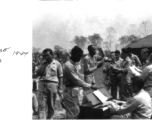 GIs singing during Church service in Chabua, India, during WWII.  Photo provided by Michael J. O'Brien to the editors of Ex-CBI Roundup (through reader submission) over many years of publication, and provided to the Remembering Shared Honor project.