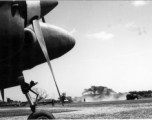 View of an Allied base from the nose of a P-38 in SW China or Burma, during WWII.