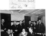 Dorothy Leuba and Elizabeth May surrounded by attentive GIs at a party and dance at the Hostel #10 Officer's Club on January 19, 1945. Seated to left is also Sam Gale, and to right, Tom Angel.  Image provided by Dorothy Yuen Leuba.