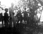 A camera-toting GI with local people in Misamari, India.  Local images provided to Ex-CBI Roundup by "P. Noel" showing local people and scenes around Misamari, India.    In the CBI during WWII. 