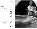 A Chinese woman nurses a baby in a boat on a canal in Kunming during WWII, May 1945.