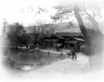 Ladies washing clothing in a village pond near Yangkai, Yunnan province, China. During WWII.