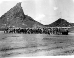 Yang Tong Airbase In 1944:"All the runways in China were made of crushed stone. They started the base with the larger stone and each layer that was added was of a smaller stone. The final layer of the runway surface was was made of finely crushed stone that was rolled and rerolled by Chinese coolies pulling a huge stone roller as shown in this picture. One of the big problems with our runways was the larger stone kept working their way to the surface and the runways had to be constantly policed to remove th