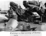 Two American fighter planes, apparently P-51s, collided on a runway at Yunnanyi, China, during WWII, in 1944.