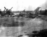 Soldiers look at a burned P-51 fighter in China during WWII.