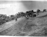 12th Air Service Group convoy waiting to cross barge in China during WWII.