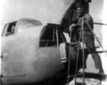 An American armorer prepares a B-25. In China during WWII.