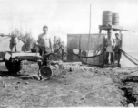 GIs bathing at Liuzhou from 55-gallon drums. During WWII.