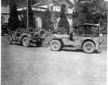 American jeeps parked in front of building used for some kind of military offices in Guangxi, China, during WWII.