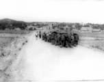 Chinese laborers move a heavy object, possibly a cement roller. During WWII. In SW China.