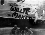 Two US servicemen pose in front of the B-24 "Willie Mak'er".  From the collection of Robert H. Zolbe.