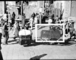 People transporting possessions in Guilin during WWII, possibly in preparation to fleeing in the face of the Japanese Ichigo campaign.