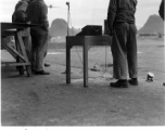 A film crew records the landing of an American fighter plane at Guilin during WWII.