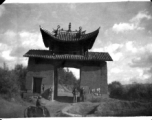 Three American servicemen strolling the countryside near Yangkai, Yunnan, China.  A local boy rides a cow or oxen in front.  Walter S. Polchlopek, Corporal, was lost on May 20, 1944, over the sea near the south east coast of China, after a B-24 mission to strike Japanese shipping.