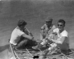 GIs and Chinese soldiers float on a sheep-skin raft in northern China, probably on the Yellow River. During WWII.