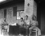 GI members of SACO and a Chinese soldier relax in northern China during WWII. 