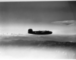 B-24 in the CBI during WWII,  flying over mountains in the southwest China region.