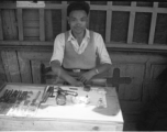 A local watch repair stand in SW China during WWII.