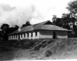 A building in the CBI, presumably used by the 27th Troop Carrier Squadron. During WWII.