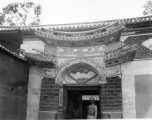 Ornate door, especially characteristic of some areas in Yunnan, Yunnan province, China. Door to a compound appropriated by Nationalist soldiers. During WWII.