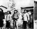 Local village children, including one girl from a wealthy family. Probably near Yangkai. During WWII.