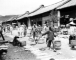 A bustling village street in SW China during WWII.