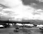 American tent camp on Burma Road in the Xiaguan/Dali area, with Erhai Lake in the background. During WWII.