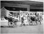 African-American GIs touring in India during WWII. "Rickshaws are almost as common in India as they are in China. Some of the...troops are on their way to see `Tarzan's New York Adventure'---in India..."