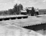 Flat mud roofs and ceremonial arch in northern China. 