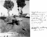 Elderly woman at Hostel #3, October 1945, near Kunming, China. Chinese MP barracks in rear, right.