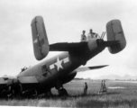 Howard Mealey, Stengle on the B-25 "Rum Runner", tail number #445, Liuzhou, June 1944.  The aircraft had crashed landed after returning from a mission and the men are in the process of salvaging all useable parts. (Info courtesy Tony Strotman)