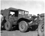 Men repair a damaged ATC ground transport vehicle, damaged by shrapnel or bullets. In China during WWII.