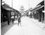 Main street leading to drum or bell tower in the city center at Hanzhong, during WWII.