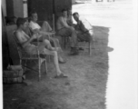 American officers lounging in the cool shade at the officer's quarters at Hanzhong, China, 1945.